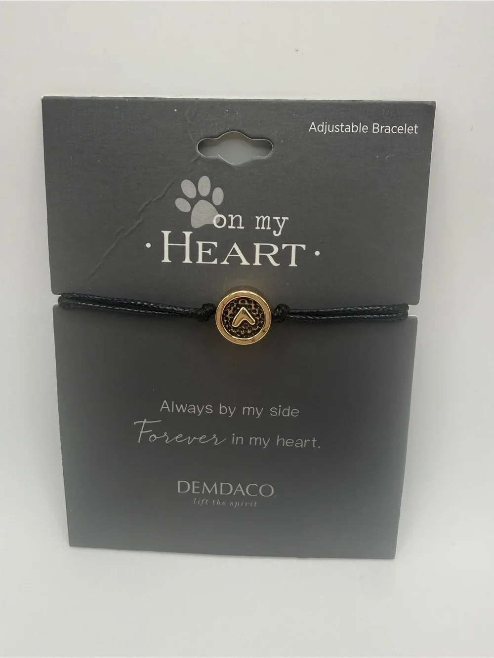Demdaco Black Cord Bracelet with Gold Paw Accent